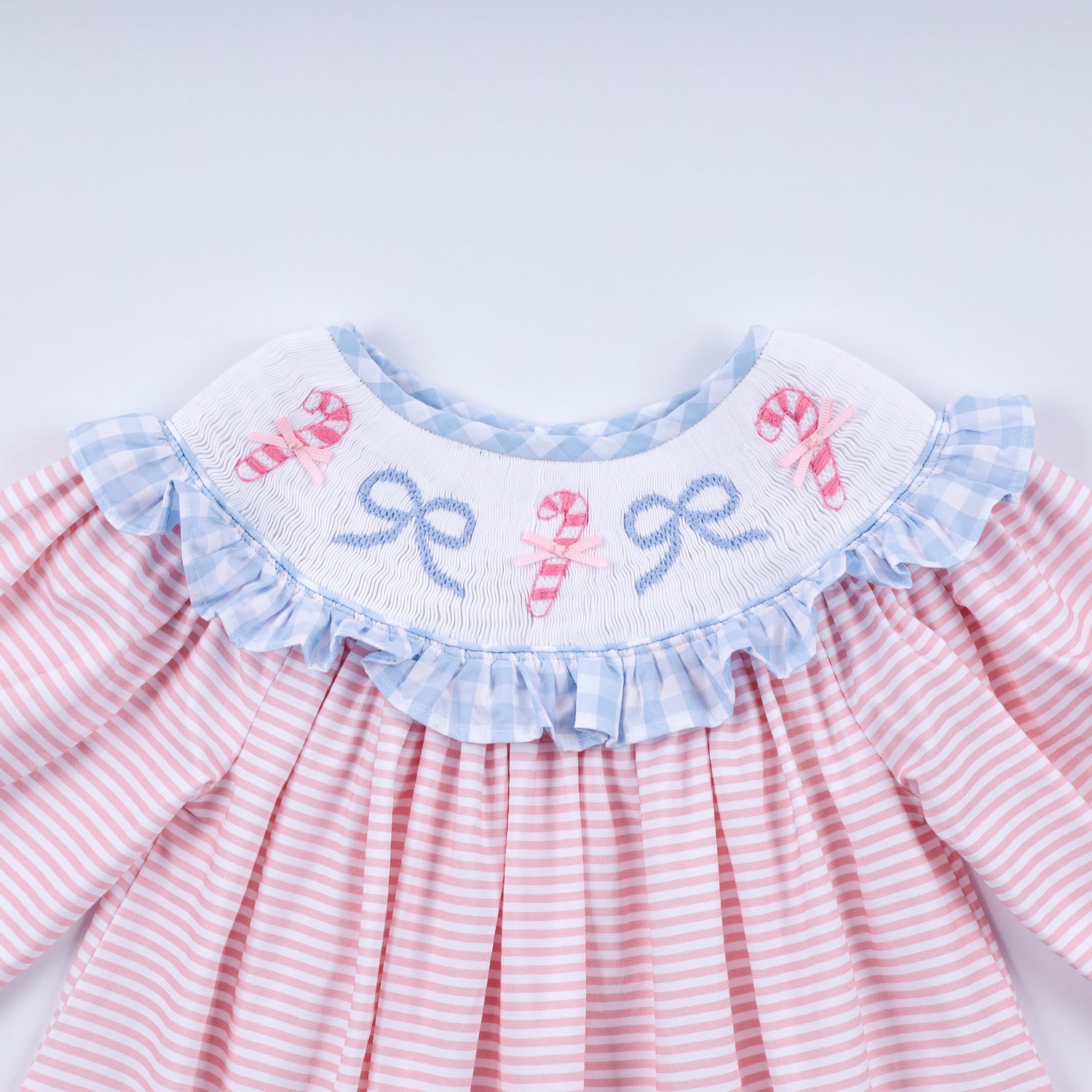 PINK CANDY CANE BOW HAND SMOCKED RUFFLE DRESS