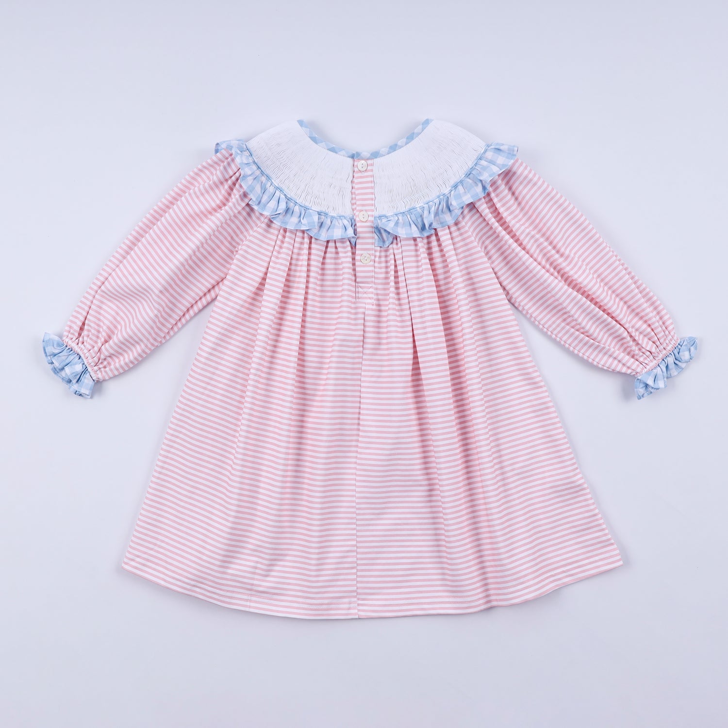 PINK CANDY CANE BOW HAND SMOCKED RUFFLE DRESS