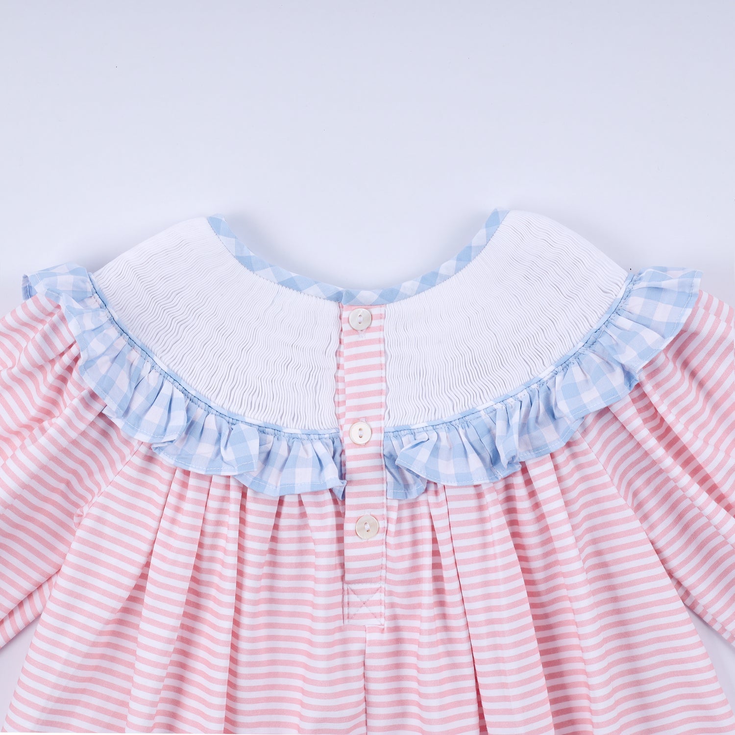 PINK CANDY CANE BOW HAND SMOCKED RUFFLE DRESS