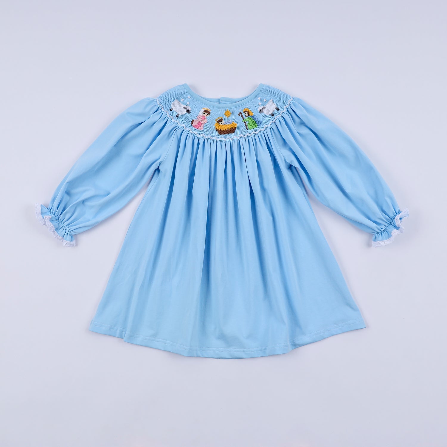BLUE NATIVITY HAND SMOCKED DRESS