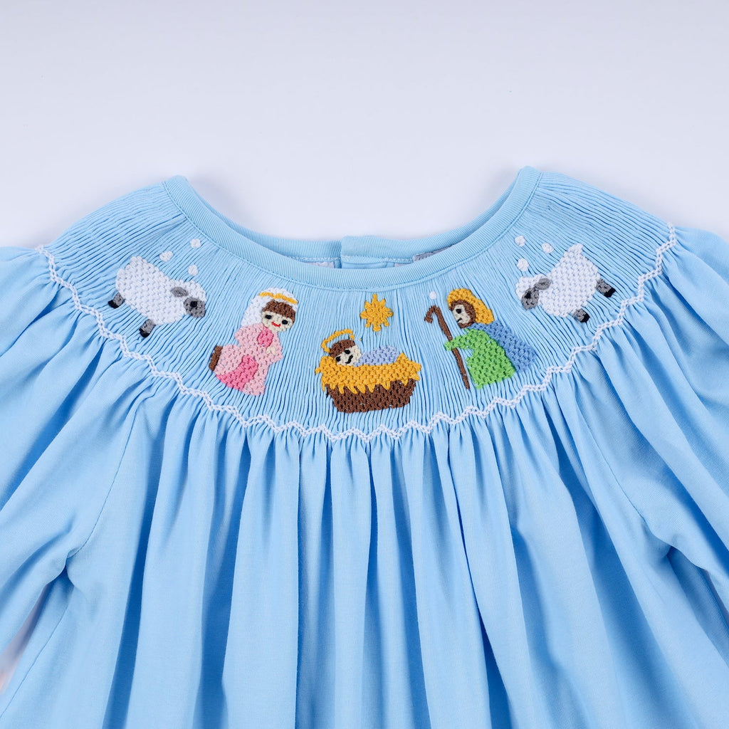 BLUE NATIVITY HAND SMOCKED DRESS