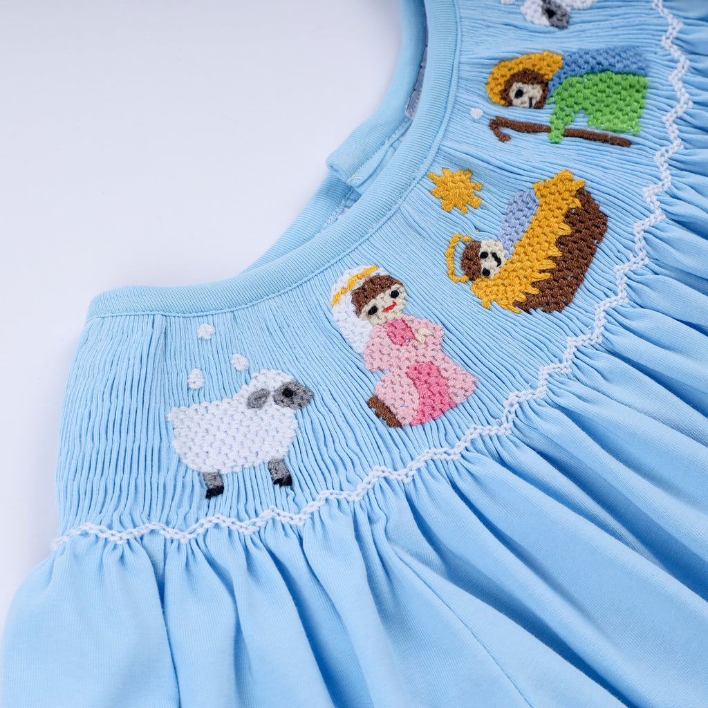 BLUE NATIVITY HAND SMOCKED DRESS