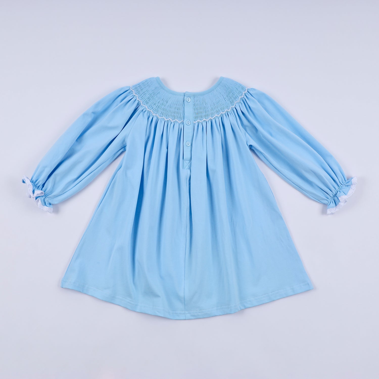 BLUE NATIVITY HAND SMOCKED DRESS