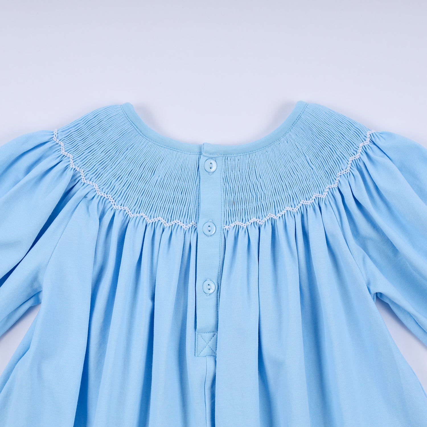BLUE NATIVITY HAND SMOCKED DRESS