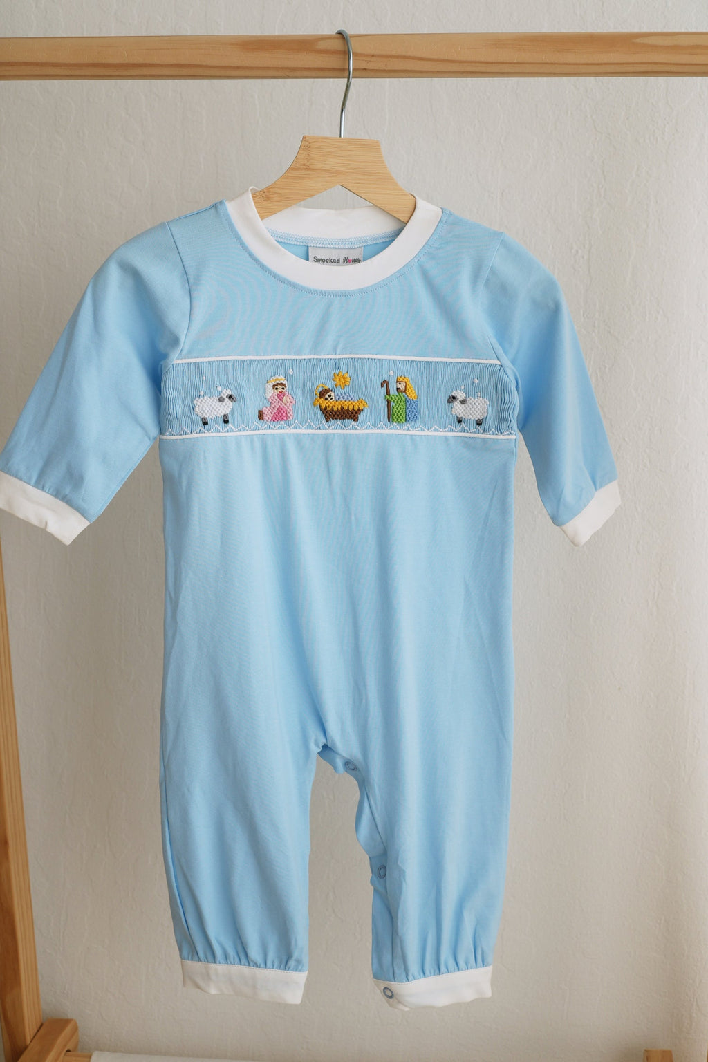 BLUE NATIVITY HAND SMOCKED ROMPER