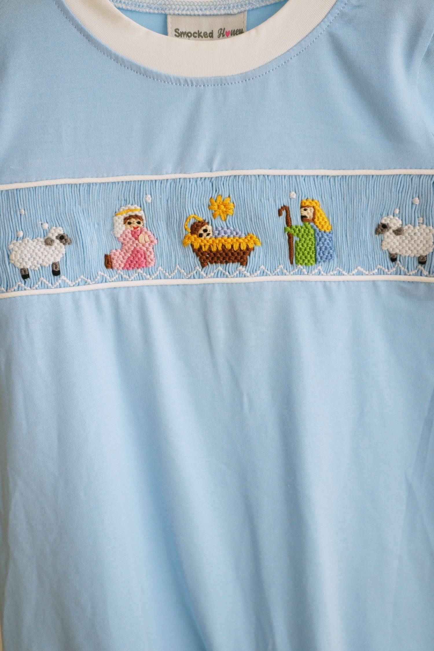 BLUE NATIVITY HAND SMOCKED ROMPER